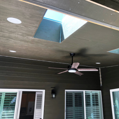 Ceiling fan and recessed can lights in outdoor covered patio in Tualatin by Classic Electric