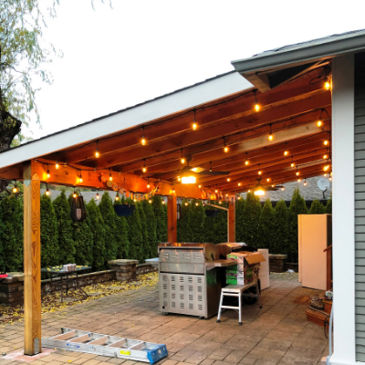 String lights and ceiling fans in outdoor covered patio by Classic Electric in Sherwood