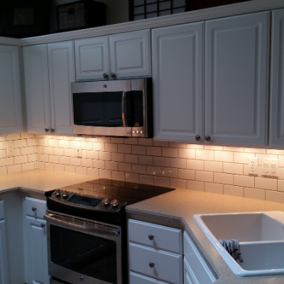 Kitchen remodel under-cabinet lights and GFCI plug in Sherwood by Classic Electric